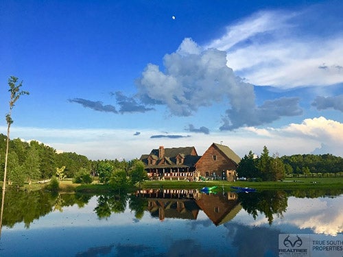 Farm house by lake