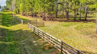 Wooden fence on grassy land