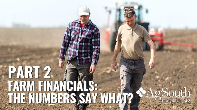 Men walking across a tilled field