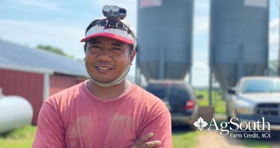 Poultry Farmer Z Kam In Front of His Chicken Houses