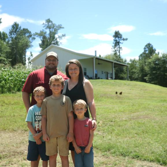 Learn how this family bought land and built their home getaway from the city with AgSouth Farm Credit.